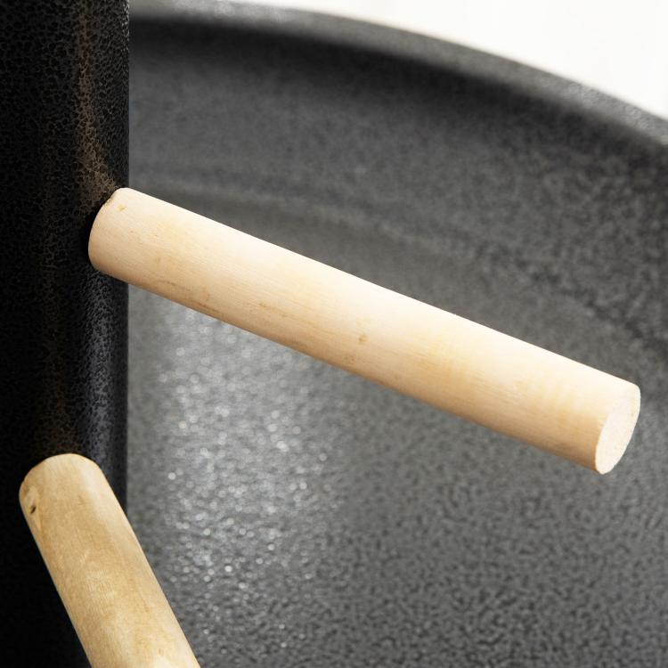 Wooden bird perches on a black stand post above a round feeding tray