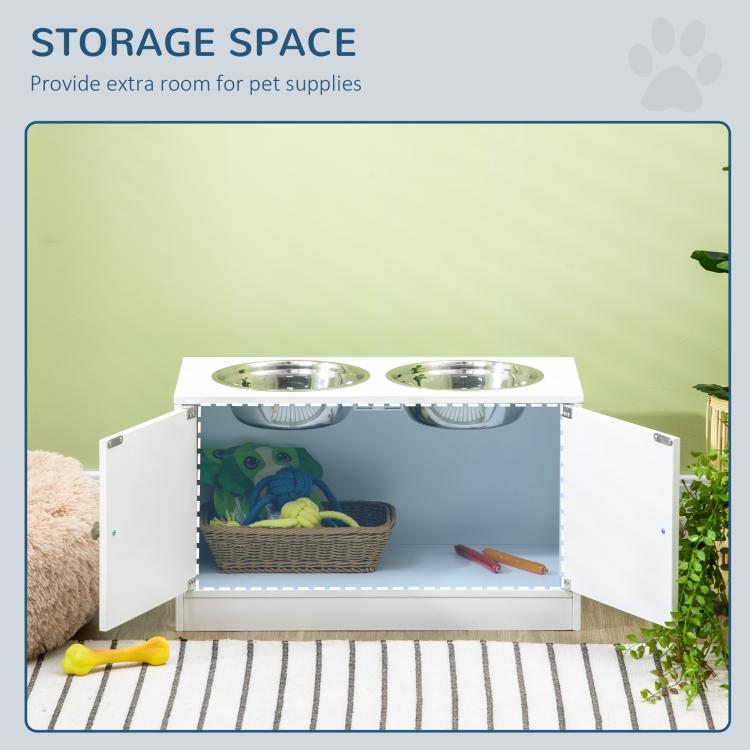 White raised dog feeding stand with two bowls and open storage cabinet