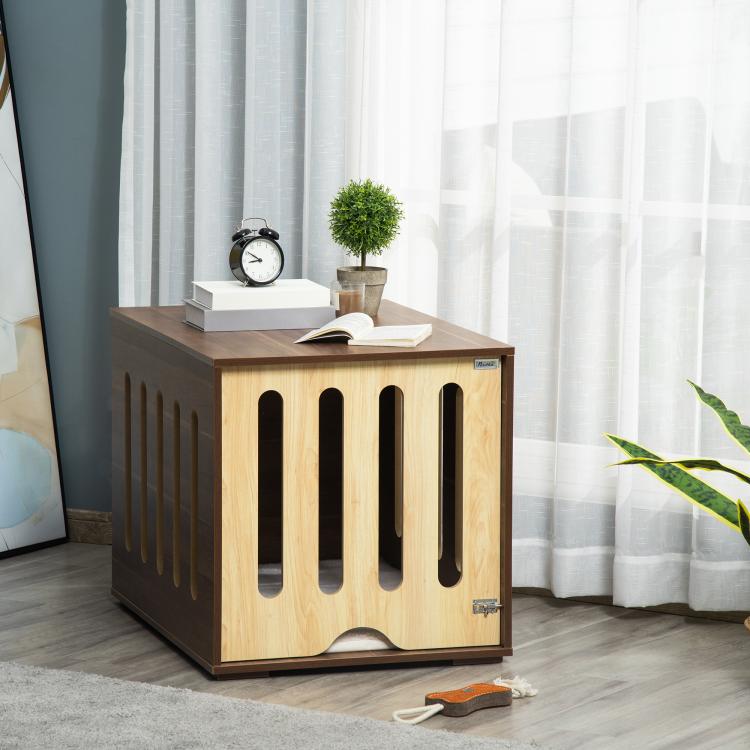 Brown dog crate end table with slatted sides and front opening, foam cushion inside