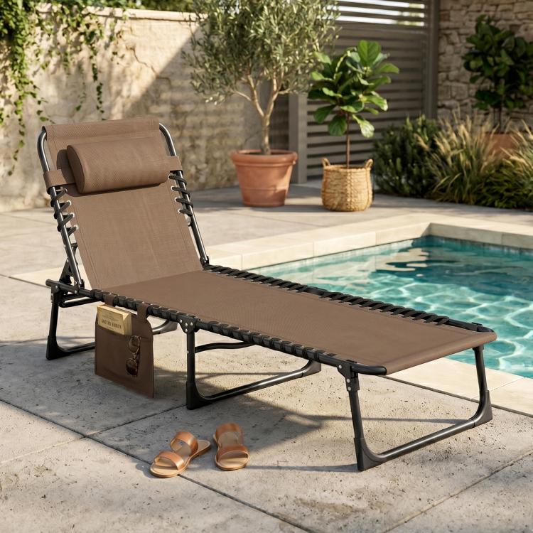 Brown folding chaise lounge chair with padded backrest and integrated side pocket