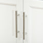 White rolling kitchen cart edge with two metal pull handles and side panel