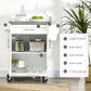 White rolling kitchen cart with large drawer, knife rack, spice rack, and two-tier cabinet