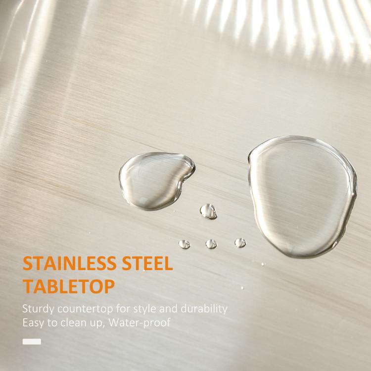 Stainless steel tabletop with water droplets on white rolling kitchen cart