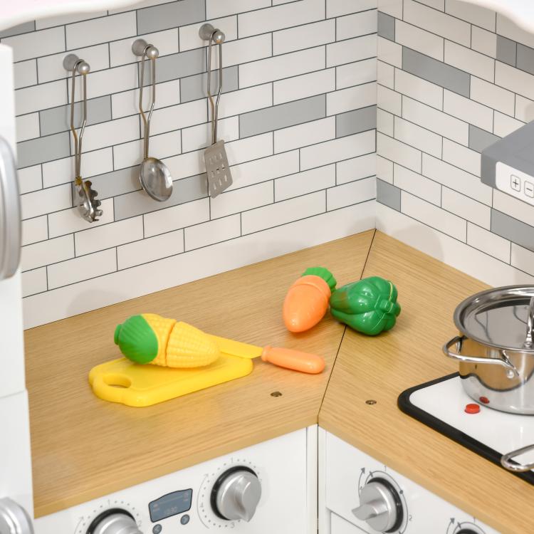 Kids play kitchen set with light wood counter and colorful pretend food toys