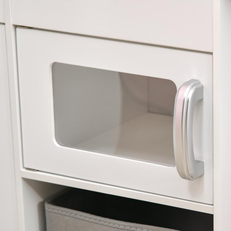 Close-up of a white play kitchen oven drawer with curved silver handle