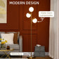 Gold floor lamp with three white globe glass shades and a round metal base