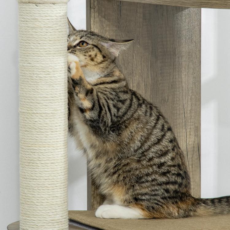 Cream white cat tree with sisal scratching post, with a tabby cat resting