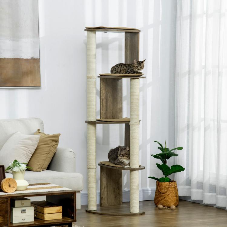 Cream-post cat tree with dark wood platforms; tabby cat perched on a middle level
