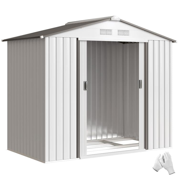 White outdoor storage shed with sliding doors open, empty interior floor visible