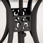 Black round patio table base with decorative cast cutout on pedestal leg