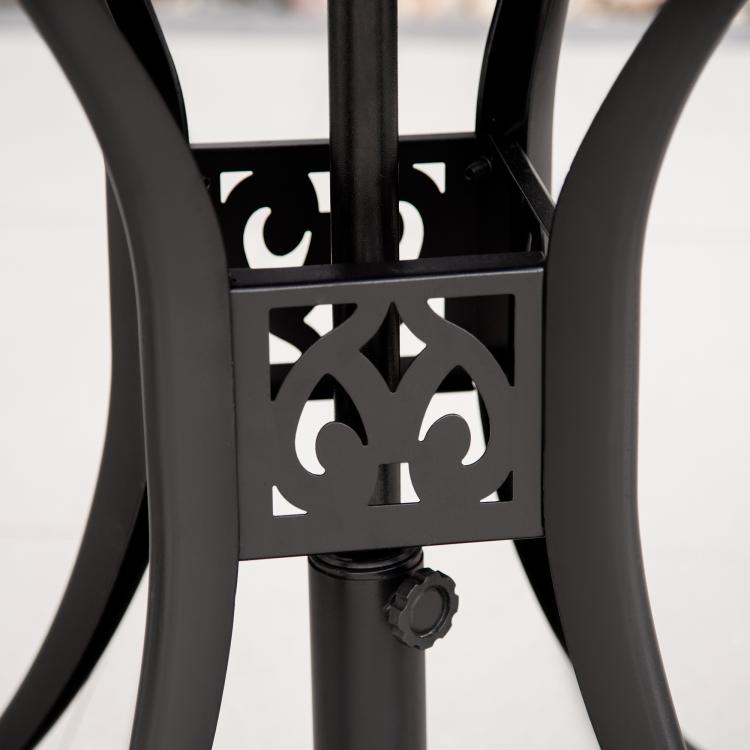Black round patio table base with decorative cast cutout on pedestal leg