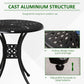 Black cast aluminum round table with hollow lattice design and adjustable footpads