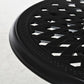 Close-up of black round lattice tabletop edge with decorative rim pattern