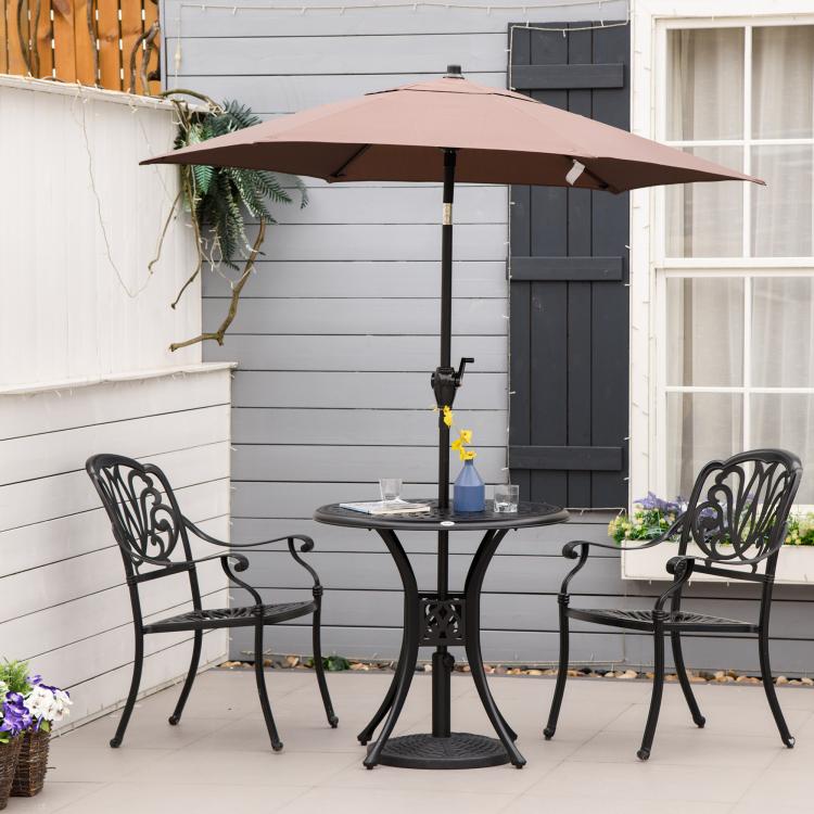Black round patio bistro table with umbrella pole and perforated tabletop