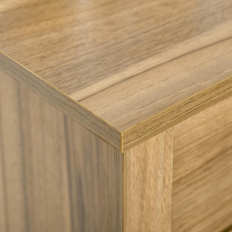 Close-up of light wood cabinet corner with beveled edge trim