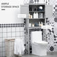 Gray over-toilet cabinet with open double doors, interior shelves, and open lower shelf