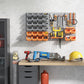 Wall pegboard tool organizer with gray bins, orange trays, and hanging hooks