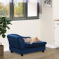 Blue pet sofa bed couch in living room with small dog lying on seat