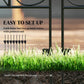 Black steel fence post legs insert into ground for setup, shown beside grass