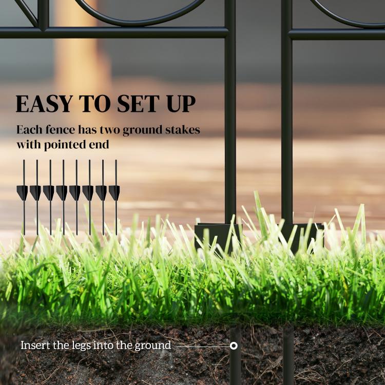 Black steel fence post legs insert into ground for setup, shown beside grass