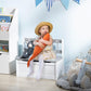White toddler storage bench with gray star-patterned top, toddler using the seat