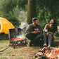 Black tabletop gas grill with open lid, thermometer, and folding legs