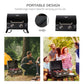 Black portable tabletop gas grill with closed lid and folding legs