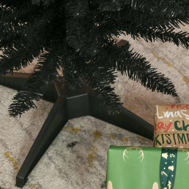 Black artificial pencil Christmas tree with dense branches and black plastic stand