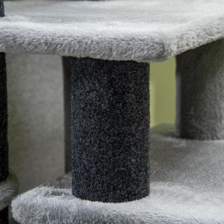 Close-up of gray and dark plush platforms on a cat scratching post