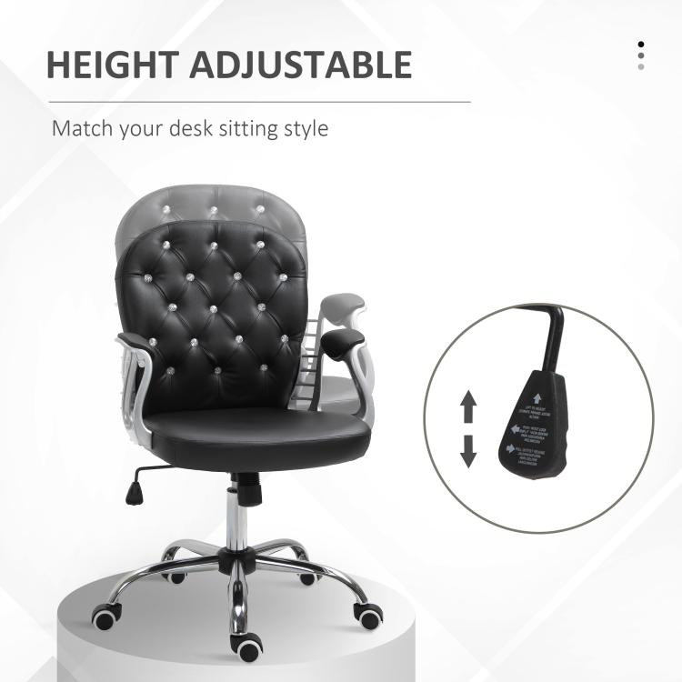 Black tufted swivel desk chair with height adjustment lever and padded armrests