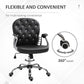 Black tufted swivel desk chair with 360-degree base and padded armrests