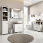 Freestanding under-sink cabinet, white with two paneled doors and black knobs