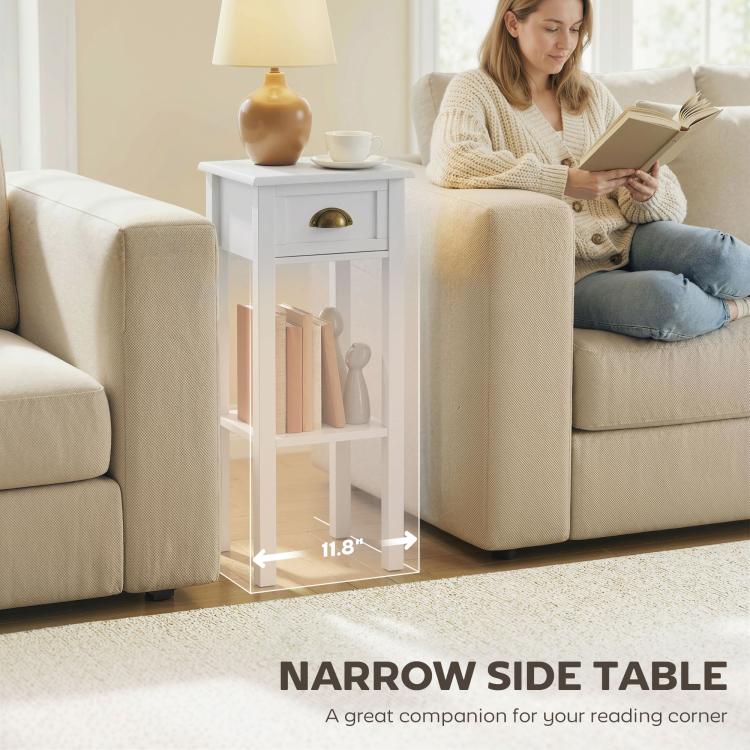 White narrow side table with drawer and open shelf, gold-tone handle by couch