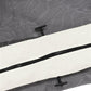 Close-up of black zipper track and pull on dark gray mesh sidewall netting