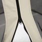 Close-up of cream mesh sidewall zipper with black zipper track