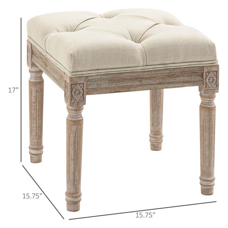 Beige ottoman bench with button-tufted seat and carved wooden legs