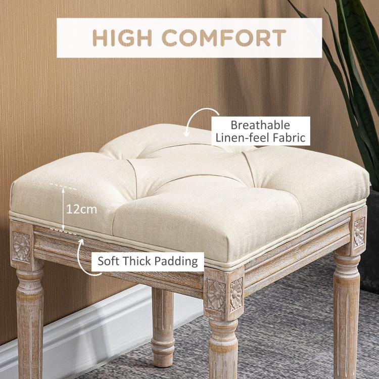 Beige ottoman bench with tufted cushion top and thick padded upholstered seat