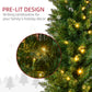 Close-up of pre-lit artificial Christmas tree branches with warm white LED lights.