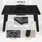 Black fire pit grill with round handle, perforated spark screen area, sturdy legs