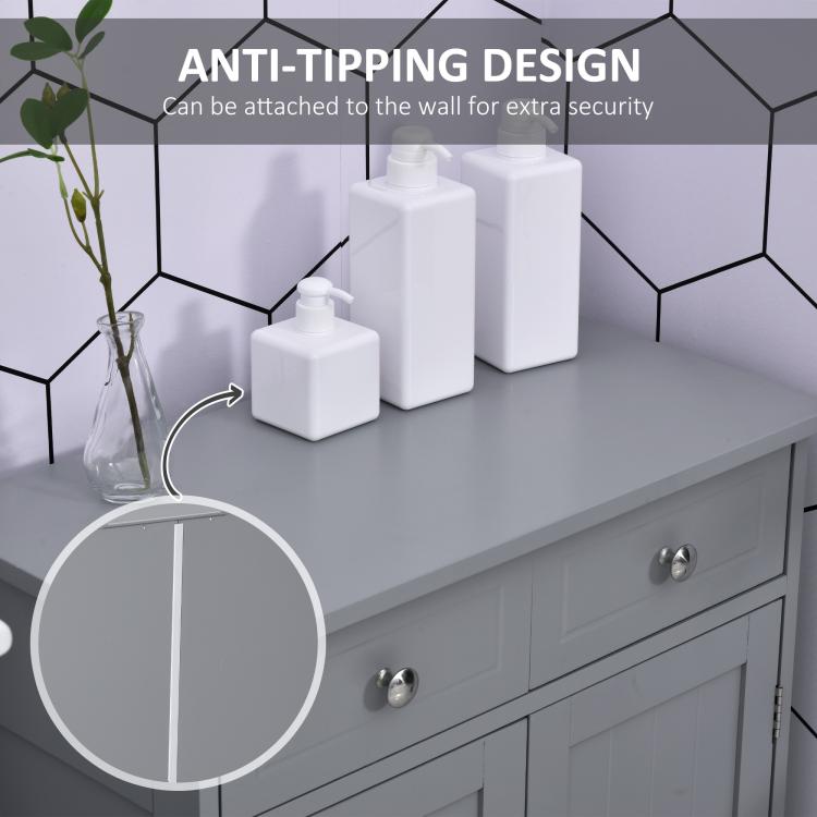 Gray cabinet top edge and drawer front with round metal knobs