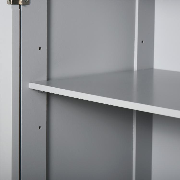 Adjustable interior shelf and side supports inside a gray bathroom cabinet