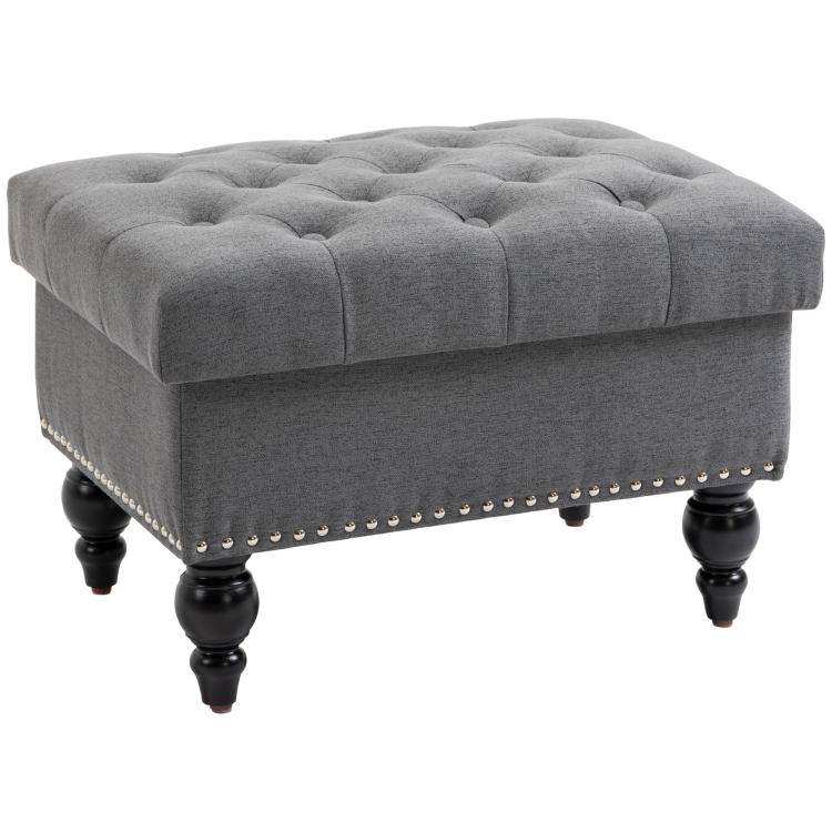 Gray button-tufted storage ottoman with removable lid, studded trim, and dark wood legs