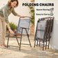 Gray folding patio chair with mesh back and seat, being carried