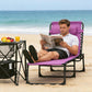 Purple folding chaise lounge chair with pillow; person reclined and reading