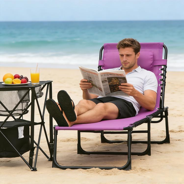 Purple folding chaise lounge chair with pillow; person reclined and reading
