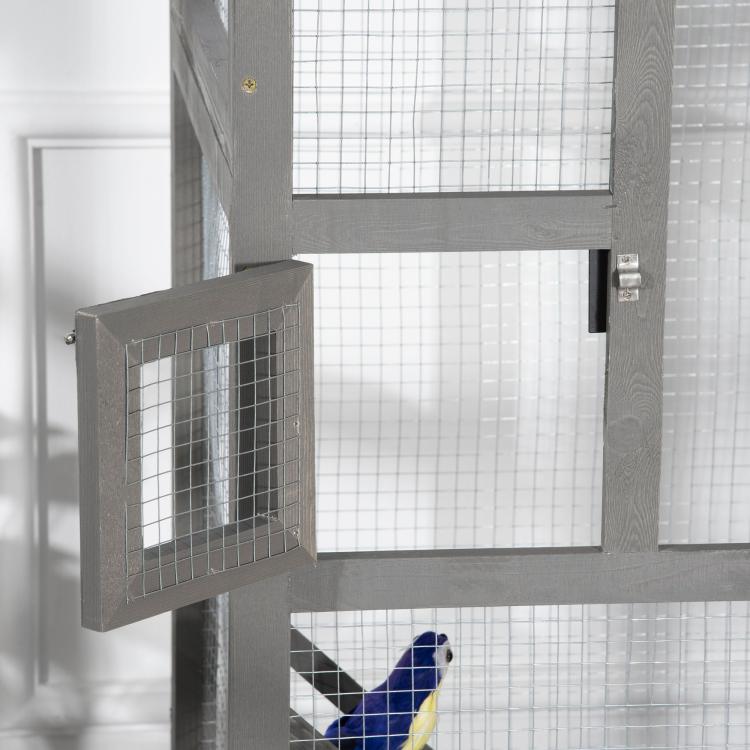 Grey outdoor bird cage with wire mesh, side door open on wooden frame