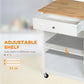 White kitchen cart with open compartment and adjustable shelf beneath wooden top