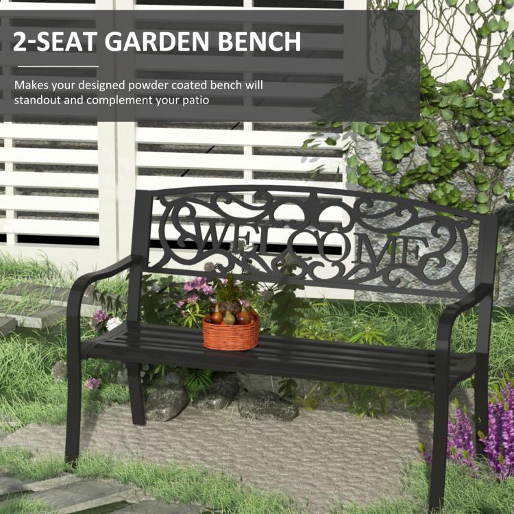 Black 2-seat garden bench with vine "WELCOME" backrest and slatted seat.