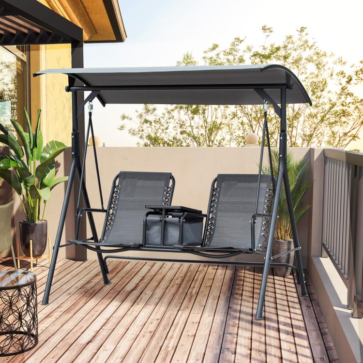 Gray 2-person porch swing with canopy, two gray sling seats, center storage table