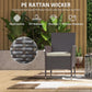 Dark coffee wicker patio chair with white cushion and visible woven texture